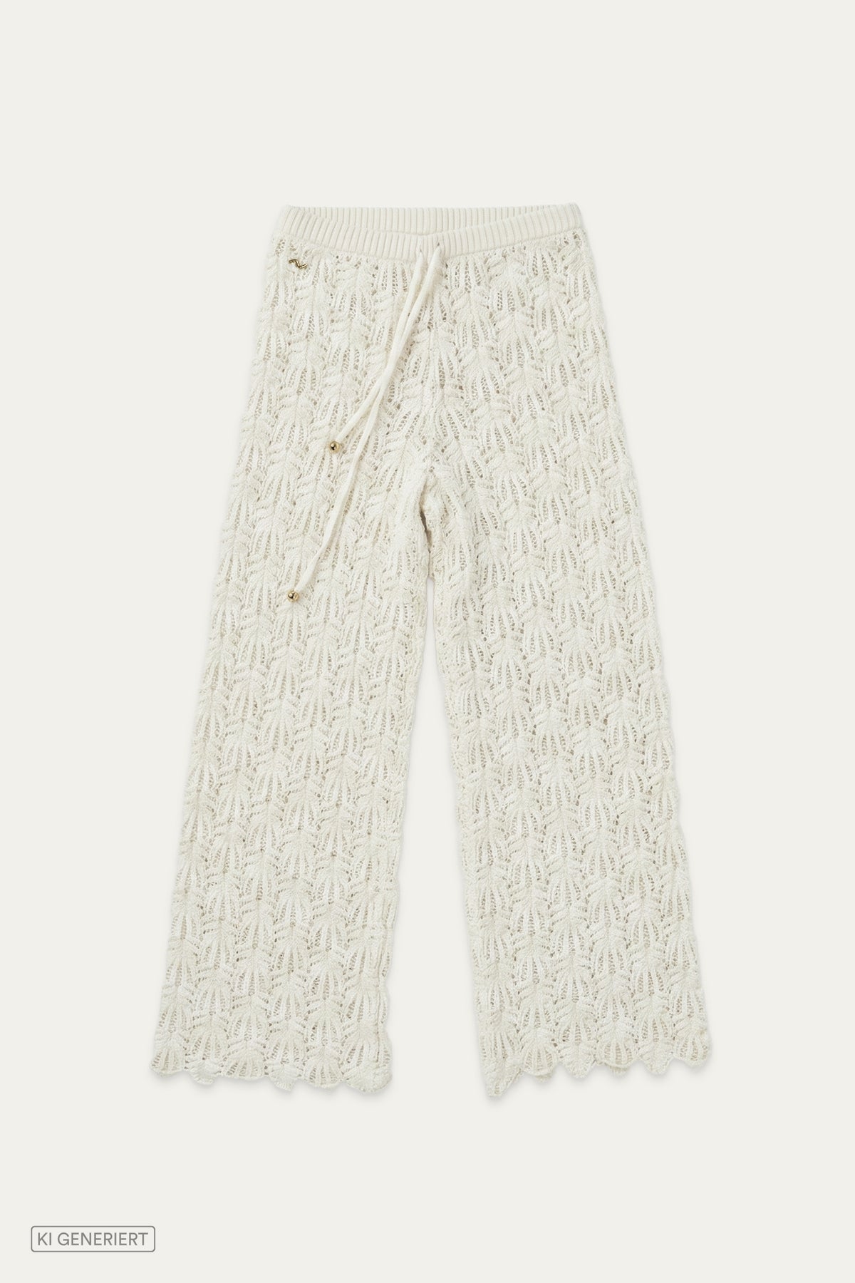 Frontansicht einer weißen Strickhose mit elastischem Bund und Bindeband, kombiniert mit Cardigan